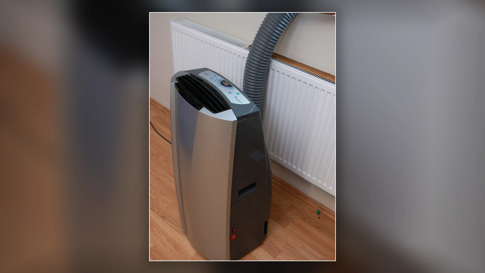 A real portable air conditioner with an exhaust hose showing why proper venting matters.